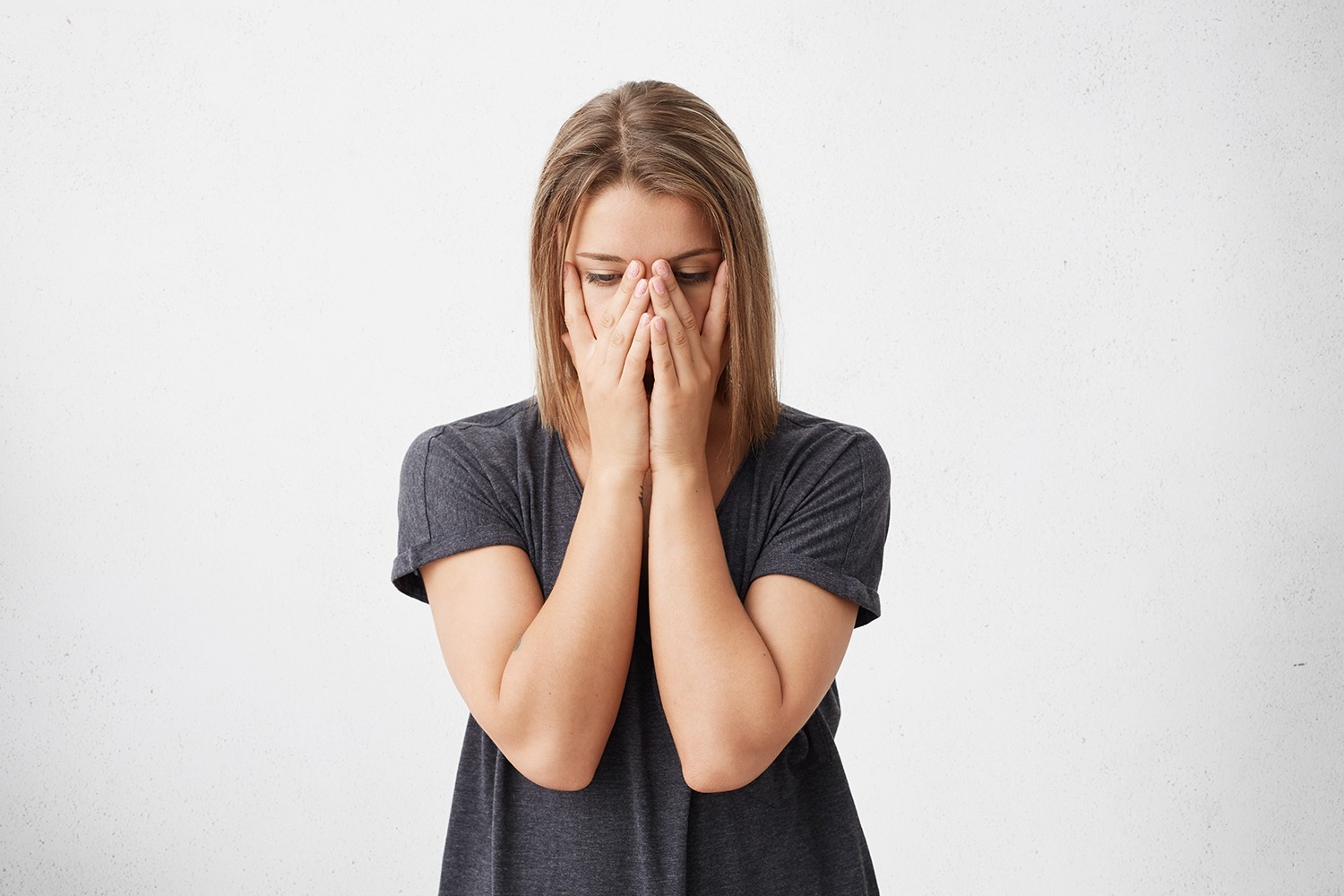 Lady with plaster on nose, doctor examining patients face after plastic surgery cropped portrait sad tired woman covering face with hands having eyes full pain stress having fatigue stressful beautiful woman having panic trying concentrate find solution