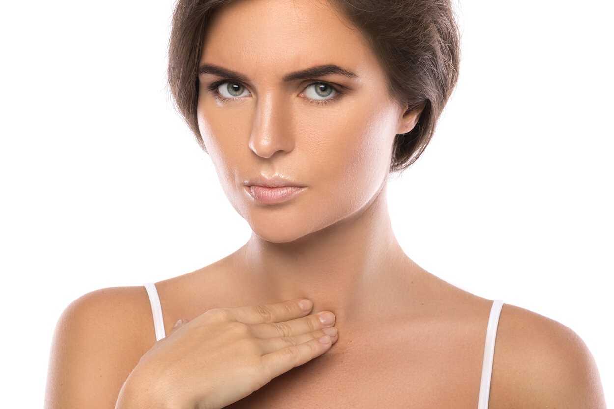Surgeon and his assistant performing cosmetic surgery on nose in hospital operating room. Nose reshaping, augmentation. Rhinoplasty. rsz woman with pain in her throat